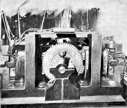 Engraving of one of the Telharmonium's alternators: a large toothed wheel turning between coils
